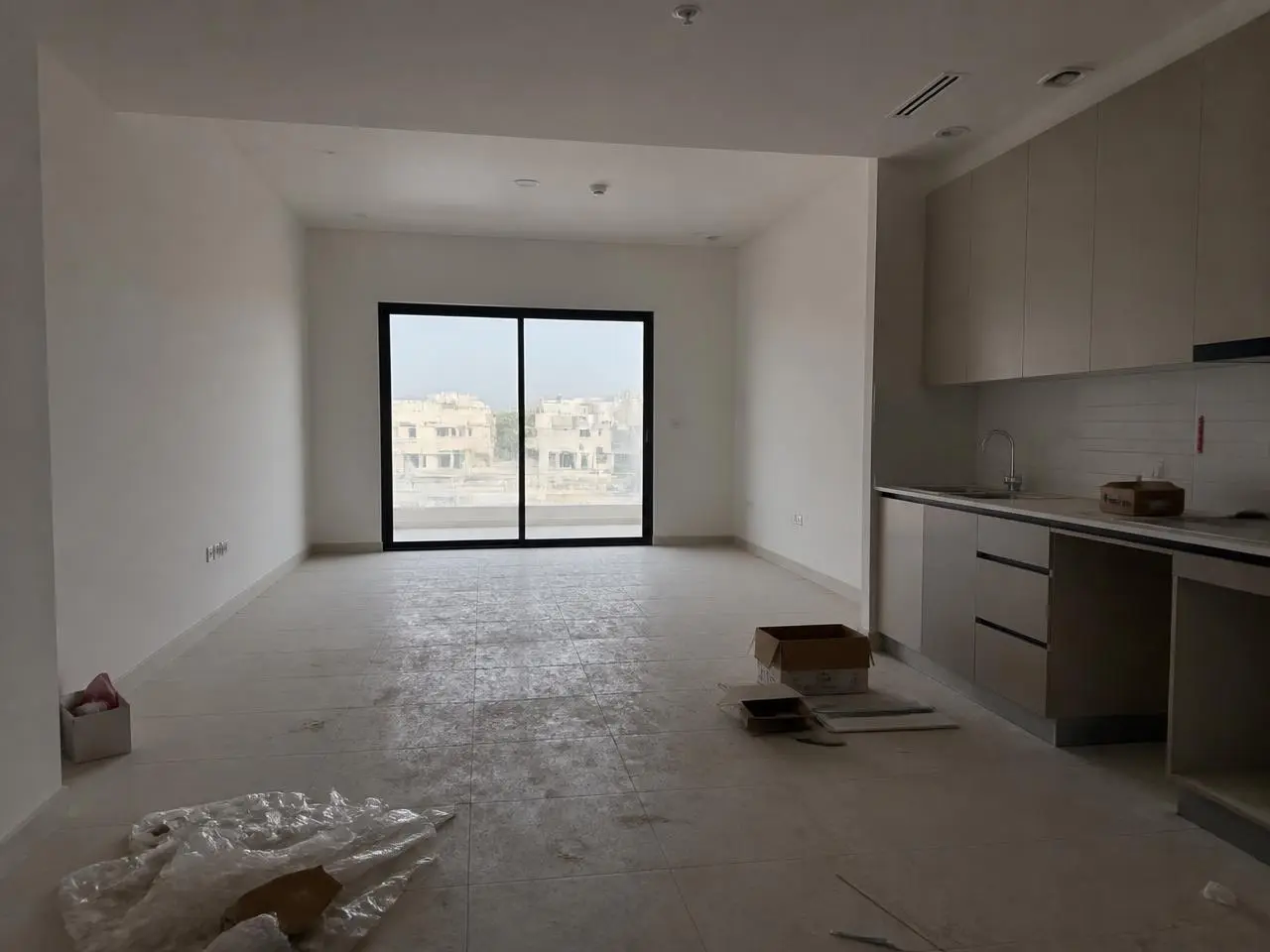 Studio apartment with construction dust and debris before deep cleaning in Dubai Studio City