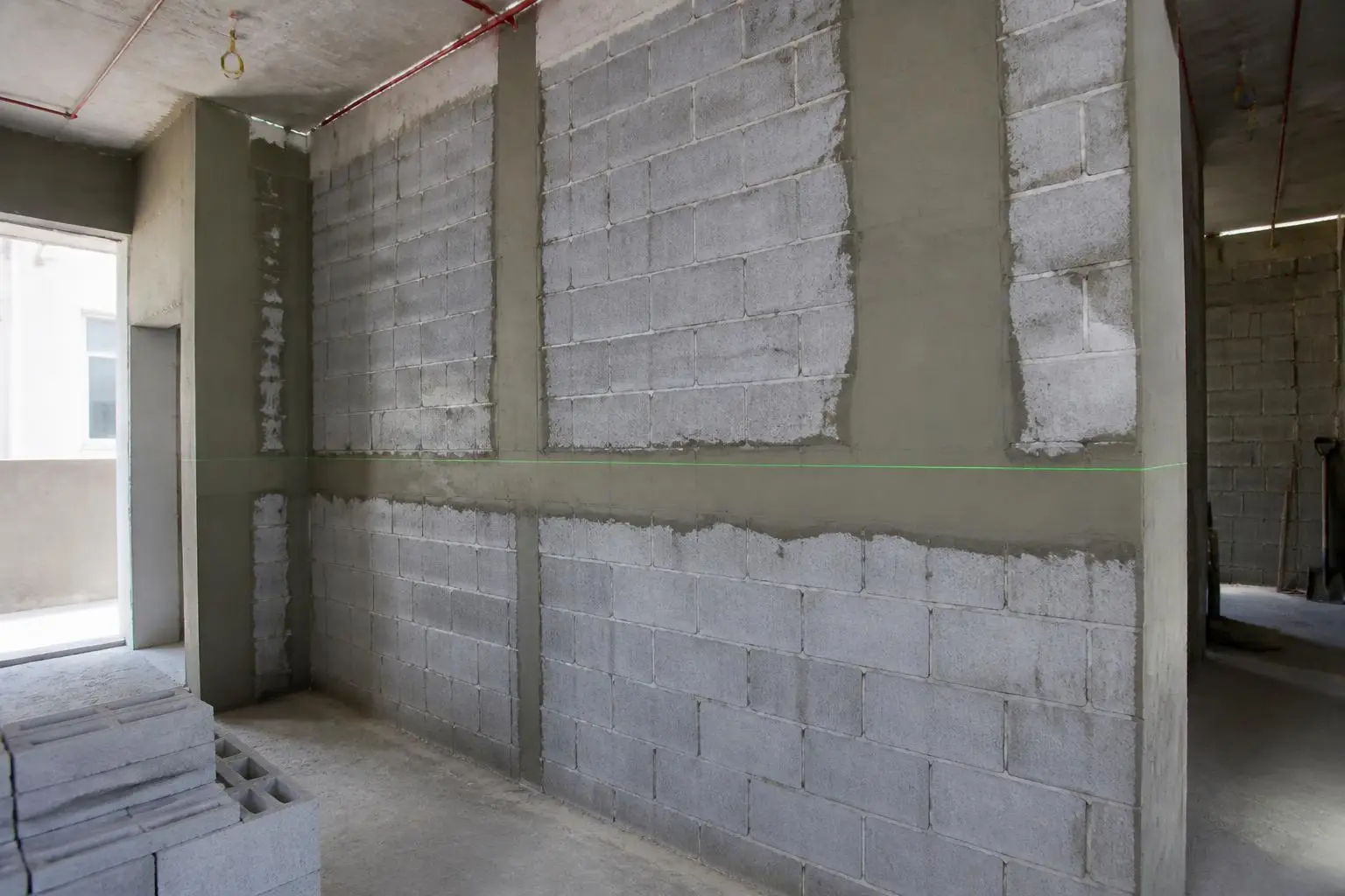 New blockwork and plastering in progress on a clean UAE site